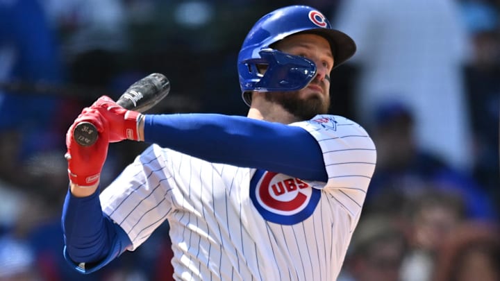 May 3, 2026; Chicago, Illinois, USA; Chicago Cubs first baseman Michael Busch (29) hits a three-run triple against the Arizona Diamondbacks during the fifth inning at Wrigley Field. Mandatory Credit: Patrick Gorski-Imagn Images