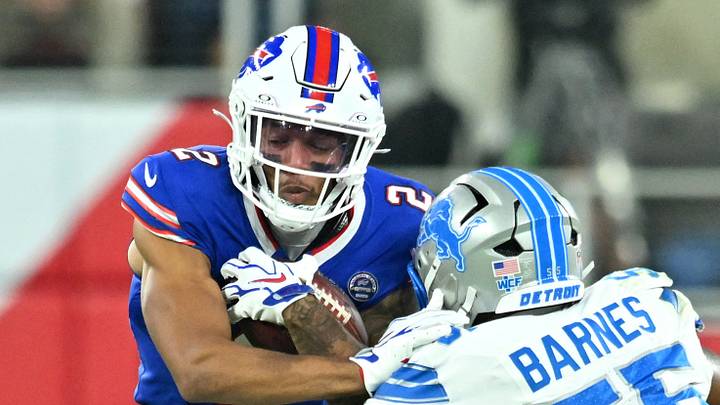 Sep 17, 2026; Orchard Park, New York, USA;  Buffalo Bills wide receiver DJ Moore (2) runs against Detroit Lions linebacker Derrick Barnes (55) during the first half at New Highmark Stadium.  Mandatory Credit: Mark Konezny-Imagn Images