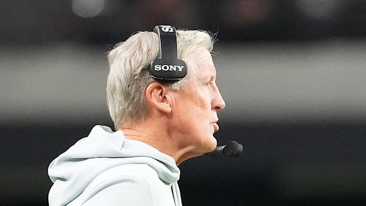 Nov 23, 2025; Paradise, Nevada, USA; Las Vegas Raiders quarterback Geno Smith (7) walks away from head coach Pete Carroll in a game against the Cleveland Browns during the fourth quarter at Allegiant Stadium. Mandatory Credit: Stephen R. Sylvanie-Imagn Images