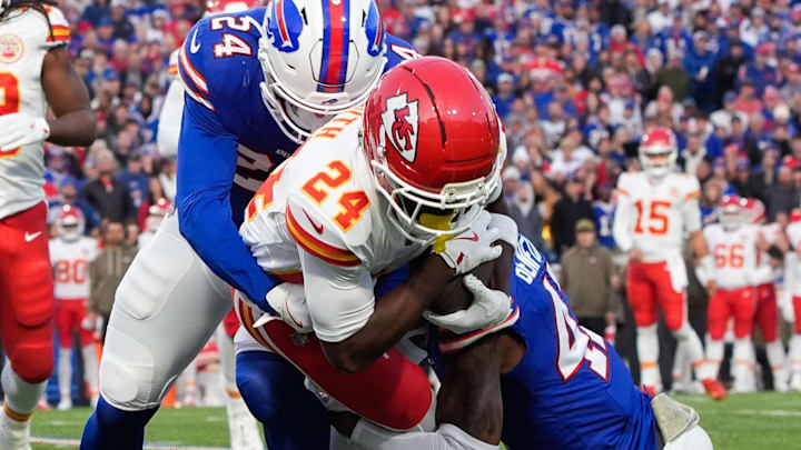 Nov 2, 2025; Orchard Park, New York, USA; Kansas City Chiefs running back Brashard Smith (24) is brought down by Buffalo Bills safety Cole Bishop (24) and cornerback Christian Benford (47) in the first quarter at Highmark Stadium. Mandatory Credit: Gregory Fisher-Imagn Images