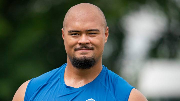Newly drafted Lion Giovanni Manu walks off the field after he works out at practice with fellow offensive lineman on Tuesday, July 30, 2024 at the Lions practice facility in Allen Park.