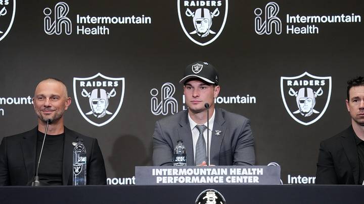 Apr 24, 2026; Henderson, NV, USA; Las Vegas Raiders quarterback Fernando Mendoza (center) speaks at introductory press conference at Intermountain Health Performance Center flanked by general manager John Spytek (left) and head coach Klint Kubiak after being selected as the No. 1 pick in the 2026 NFL Draft. Mandatory Credit: Kirby Lee-Imagn Images