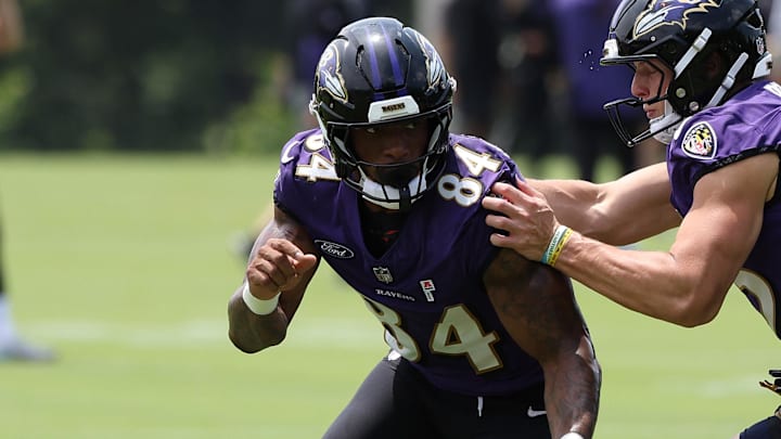 Jun 10, 2025; Baltimore, MD, USA; Baltimore Ravens tight end Zaire Mitchell-Paden (84) runs past Baltimore Ravens tight end Sam Pitz (85) during an NFL OTA at Under Armour Performance Center. Mandatory Credit: Daniel Kucin Jr.-Imagn Images