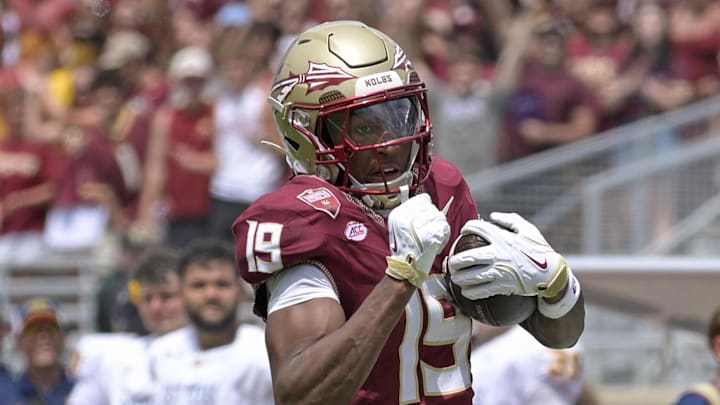 Sep 6, 2025; Tallahassee, Florida, USA; Florida State Seminoles wide receiver Micahi Danzy (19) runs the ball for a touchdown during the second half against the East Texas A&M Lions at Doak S. Campbell Stadium. Mandatory Credit: Melina Myers-Imagn Images