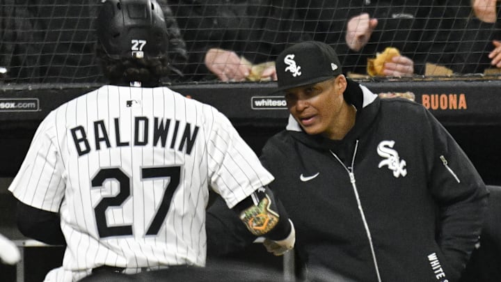 Chicago White Sox manager Will Venable (1) celebrates with Brooks Baldwin (27) against the Minnesota Twins at Rate Field. Chicago White Sox manager Will Venable (1) celebrates with Brooks Baldwin (27) against the Minnesota Twins at Rate Field.