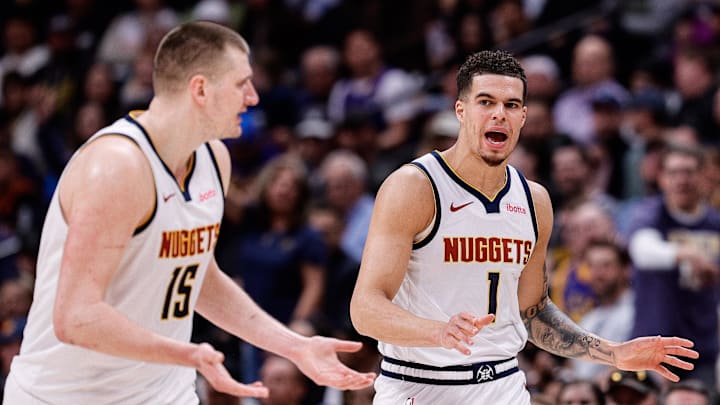 Mar 21, 2024; Denver, Colorado, USA; Denver Nuggets forward Michael Porter Jr. (1) and center Nikola Jokic (15) in the third quarter against the New York Knicks at Ball Arena. Mandatory Credit: Isaiah J. Downing-Imagn Images