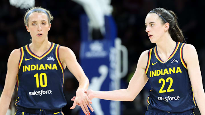 May 3, 2024; Dallas, Texas, USA; Indiana Fever guard Caitlin Clark (22) celebrates with Indiana Fever guard Lexie Hull (10) during the second quarter against the Dallas Wings at College Park Center.  Mandatory Credit: Kevin Jairaj-Imagn Images