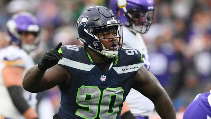Dec 22, 2024; Seattle, Washington, USA; Seattle Seahawks defensive tackle Jarran Reed (90) celebrates after sacking Minnesota Vikings quarterback Sam Darnold (14) (not pictured) during the first half at Lumen Field.