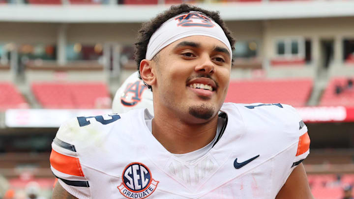 Oct 25, 2025; Fayetteville, Arkansas, USA; Auburn Tigers quarterback Ashton Daniels (12) celebrates after the game against the Arkansas Razorbacks at Donald W. Reynolds Razorback Stadium. Auburn won 33-24. Mandatory Credit: Nelson Chenault-Imagn Images Oct 25, 2025; Fayetteville, Arkansas, USA; Auburn Tigers quarterback Ashton Daniels (12) celebrates after the game against the Arkansas Razorbacks at Donald W. Reynolds Razorback Stadium. Auburn won 33-24. Mandatory Credit: Nelson Chenault-Imagn Images