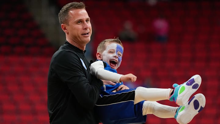 Mar 21, 2025; Raleigh, NC, USA; Duke Blue Devils head coach Jon Scheyer with his son, Jett, after the game against the Mount St. Mary's Mountaineers in the first round of the NCAA Tournament at Lenovo Center.