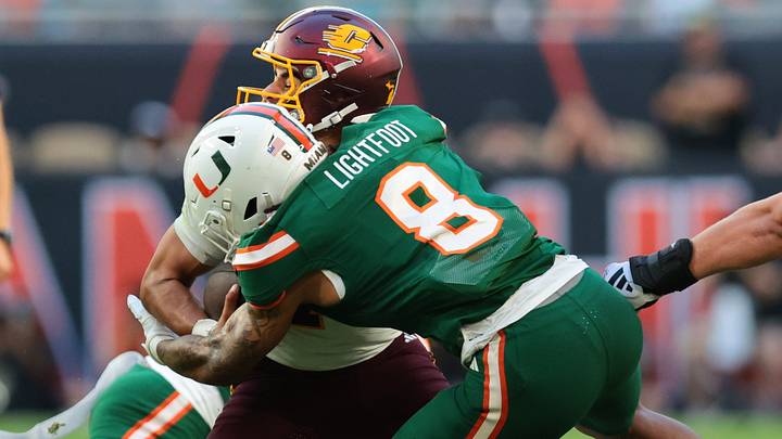 Sep 26, 2026; Miami Gardens, Florida, USA; Miami Hurricanes defensive lineman Marquise Lightfoot (8) sacks Central Michigan Chippewas quarterback Angel Flores (7) during the first quarter at Hard Rock Stadium. Mandatory Credit: Sam Navarro-Imagn Images