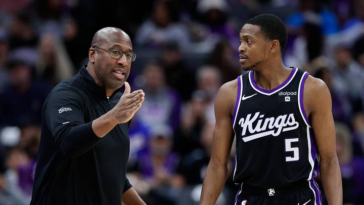 Jan 3, 2024; Sacramento, California, USA; Sacramento Kings head coach Mike Brown talks with guard De'Aaron Fox (5) during the third quarter against the Orlando Magic at Golden 1 Center. Mandatory Credit: Sergio Estrada-Imagn Images