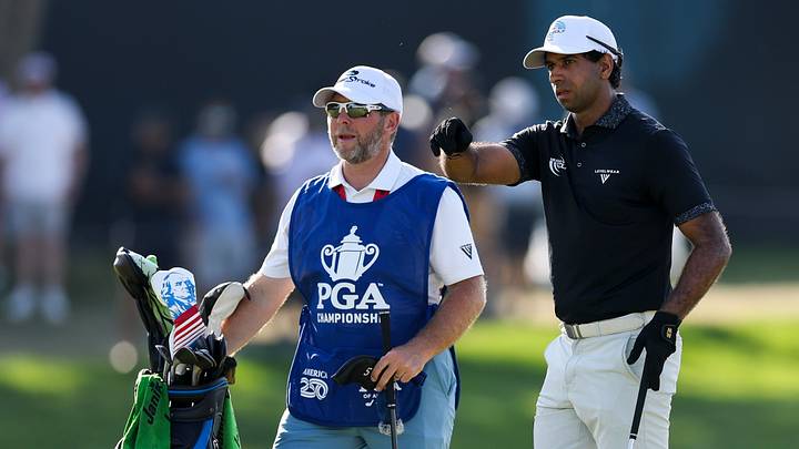 Aaron Rai, pictured with caddie Jason Timmis during the final round of the PGA Championship, has always kept covers on his irons as a pro. Aaron Rai, pictured with caddie Jason Timmis during the final round of the PGA Championship, has always kept covers on his irons as a pro.
