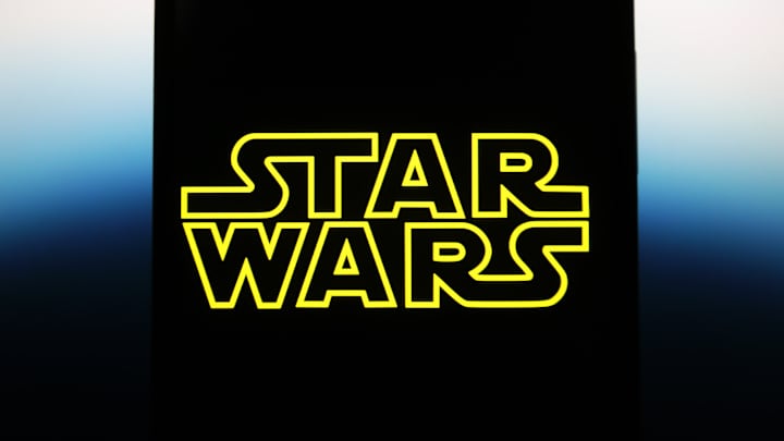 In this photo illustration, a Star Wars logo is seen on a...