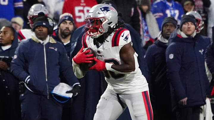 Dec 22, 2024; Orchard Park, New York, USA; New England Patriots running back Rhamondre Stevenson (38) runs with the ball after making a catch against the Buffalo Bills during the first half at Highmark Stadium. Mandatory Credit: Gregory Fisher-Imagn Images
