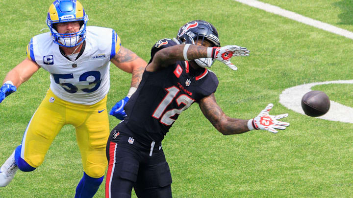 September 7, 2025, Inglewood, California, USA: 12 Nico Collins, WR of the Houston Texans drops a pass as 59 Josh Pearcy, OLB of the Los Angeles Rams defends during their regular NFL, American Football Herren, USA season game on Sunday September 7, 2025 at SoFi Stadium in Inglewood, California. Rams defeat Texans, 14-9. 