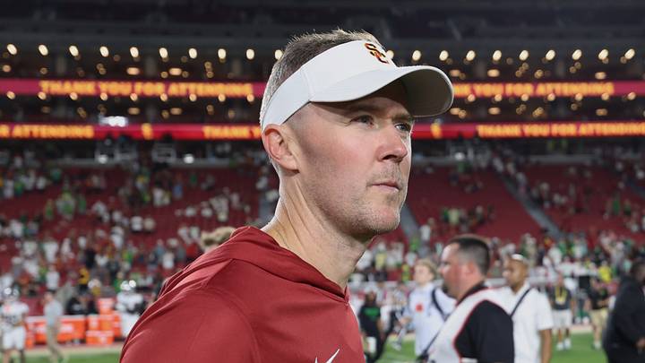 Sep 26, 2026; Los Angeles, California, USA;  USC Trojans head coach Lincoln Riley walks off the field after the game against the Oregon Ducks at United Airlines Field at Los Angeles Memorial Coliseum.  Mandatory Credit: Kiyoshi Mio-Imagn Images