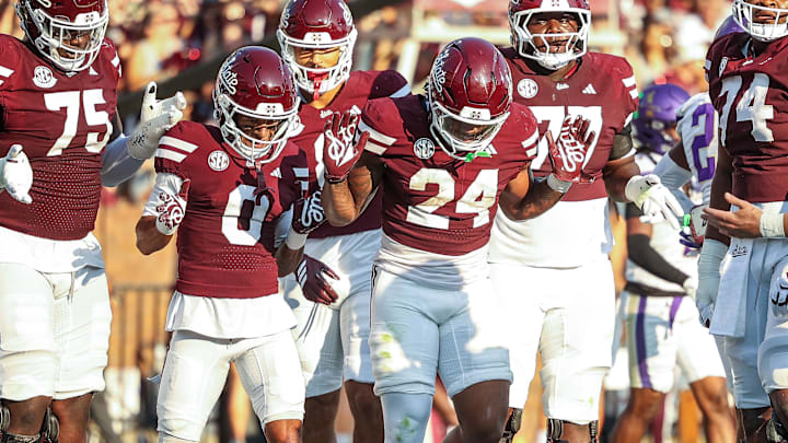 Mississippi State Bulldogs running back Fluff Bothwell (24) celebrates with teammates after a touchdown during the first quarter against the Alcorn State Braves at Davis Wade Stadium at Scott Field.