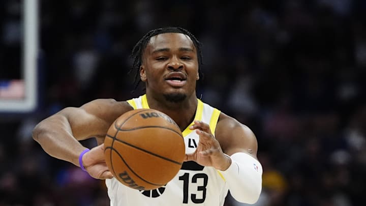 Mar 28, 2025; Denver, Colorado, USA; Utah Jazz guard Isaiah Collier (13) passes the ball in the first quarter against the Denver Nuggets at Ball Arena. Mandatory Credit: Ron Chenoy-Imagn Images