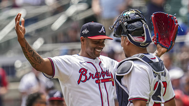 May 15, 2025; Cumberland, Georgia, USA; Atlanta Braves pitcher Raisel Iglesias (26) reacts with catcher Drake Baldwin (30) after the final out against the Washington Nationals during the ninth inning at Truist Park. Mandatory Credit: Dale Zanine-Imagn Images