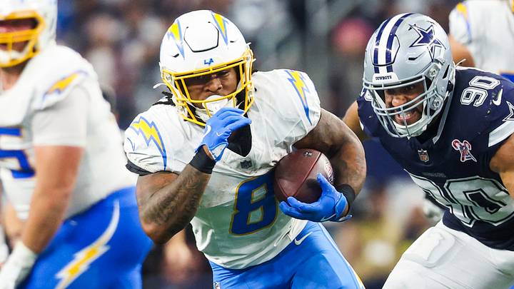 Dec 21, 2025; Arlington, Texas, USA; Los Angeles Chargers running back Omarion Hampton (8) rushes ahead of Dallas Cowboys defensive tackle Solomon Thomas (90) during the fourth quarter at AT&T Stadium. Mandatory Credit: Kevin Jairaj-Imagn Images Dec 21, 2025; Arlington, Texas, USA; Los Angeles Chargers running back Omarion Hampton (8) rushes ahead of Dallas Cowboys defensive tackle Solomon Thomas (90) during the fourth quarter at AT&T Stadium. Mandatory Credit: Kevin Jairaj-Imagn Images