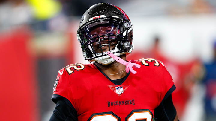 Nov 22, 2021; Tampa, Florida, USA;  Tampa Bay Buccaneers safety Mike Edwards (32) reacts after intercepting the ball in the second half against the New York Giants at Raymond James Stadium. Mandatory Credit: Nathan Ray Seebeck-Imagn Images