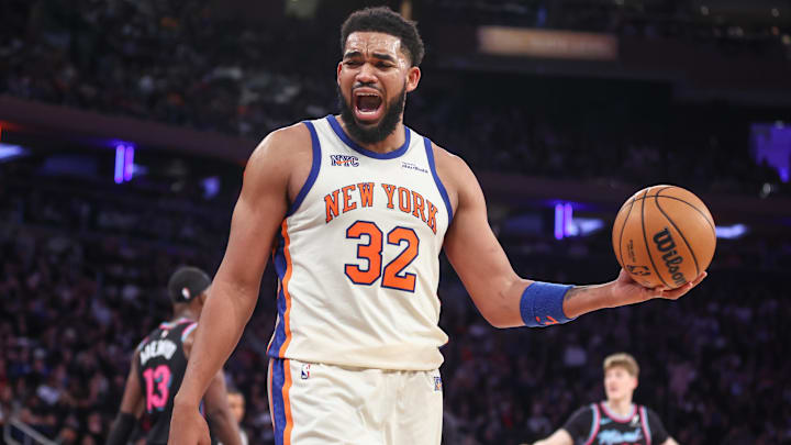 Dec 21, 2025; New York, New York, USA;  New York Knicks center Karl-Anthony Towns (32) reacts to a call in the fourth quarter against the Miami Heat at Madison Square Garden. Mandatory Credit: Wendell Cruz-Imagn Images