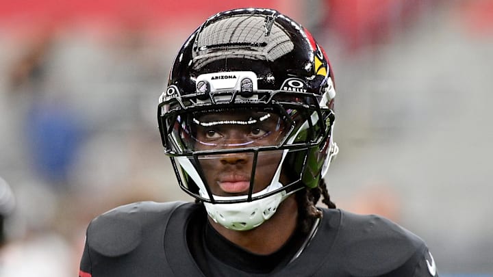 Oct 5, 2025; Glendale, Arizona, USA; Arizona Cardinals wide receiver Marvin Harrison Jr. (18) warms up before their game against the Tennessee Titans at State Farm Stadium. Mandatory Credit: Matt Kartozian-Imagn Images