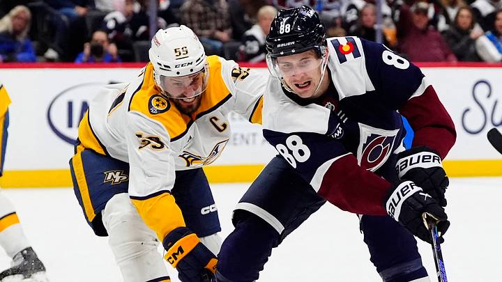 Jan 16, 2026; Denver, Colorado, USA; Nashville Predators defenseman Roman Josi (59) and Colorado Avalanche center Martin Necas (88) battle for control of the puck in the second period at Ball Arena. Mandatory Credit: Ron Chenoy-Imagn Images