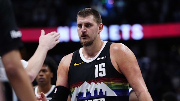 Dec 25, 2025; Denver, Colorado, USA; Denver Nuggets center Nikola Jokic (15) comes to the bench in overtime against the Minnesota Timberwolves at Ball Arena.
