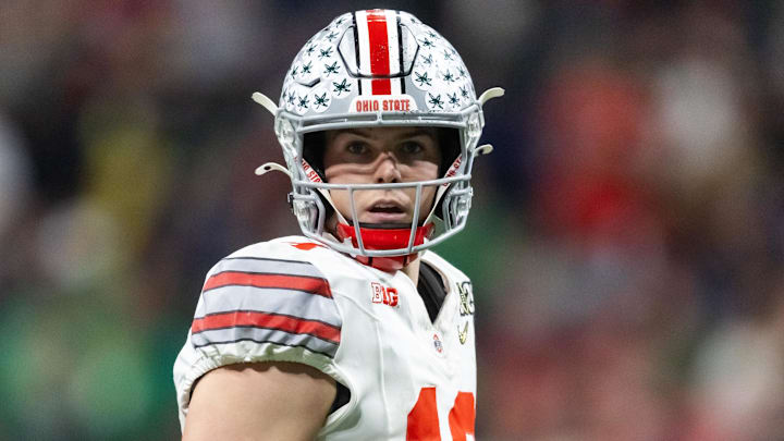 Jan 20, 2025; Atlanta, GA, USA; Ohio State Buckeyes quarterback Will Howard (18) against the Notre Dame Fighting Irish during the CFP National Championship college football game at Mercedes-Benz Stadium. Mandatory Credit: Mark J. Rebilas-Imagn Images Jan 20, 2025; Atlanta, GA, USA; Ohio State Buckeyes quarterback Will Howard (18) against the Notre Dame Fighting Irish during the CFP National Championship college football game at Mercedes-Benz Stadium. Mandatory Credit: Mark J. Rebilas-Imagn Images