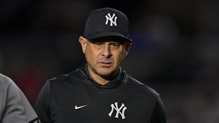 Aug 4, 2025; Arlington, Texas, USA; New York Yankees manager Aaron Boone (17) during the game between the Texas Rangers and the New York Yankees at Globe Life Field. Mandatory Credit: Jerome Miron-Imagn Images