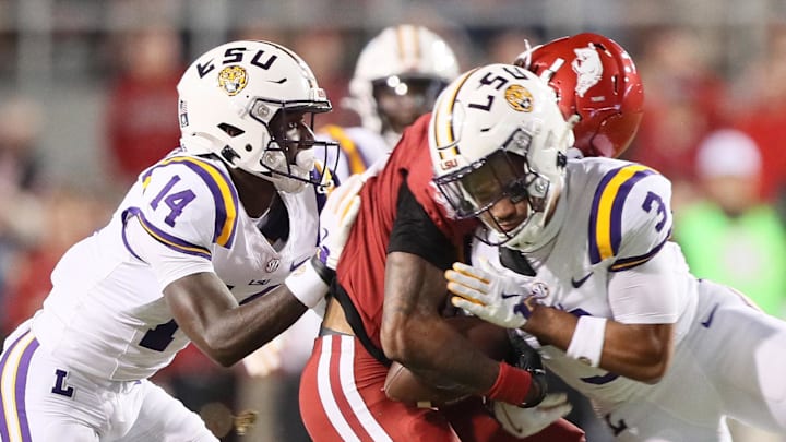 Arkansas receiver Tyrone Broden is drilled by LSU safety Sage Ryan (3) during third-quarter action at Razorback Stadium Saturday. Ryan was initially flagged for a person foul targeting penalty but that was changed following an official review and hurt the Hogs' momentum. Sam Pittman thought it should've been a penalty.