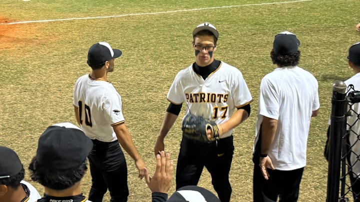American Heritage outfielder/pitcher Dylan Dubovik (17) gets congratulated after his pitching performance against Miami Christian. American Heritage outfielder/pitcher Dylan Dubovik (17) gets congratulated after his pitching performance against Miami Christian.