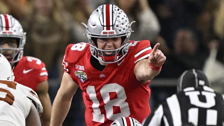 Jan 10, 2025; Arlington, Texas, USA; Ohio State Buckeyes quarterback Will Howard (18) points toward the Texas Longhorns defense during the fourth quarter of the College Football Playoff semifinal in the Cotton Bowl at AT&T Stadium. Mandatory Credit: Jerome Miron-Imagn Images