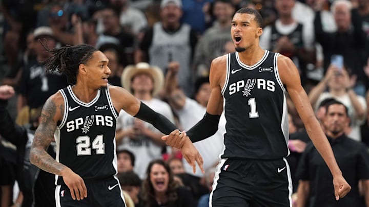 May 12, 2026; San Antonio, Texas, USA; San Antonio Spurs forward Victor Wembanyama and guard Devin Vassell (24) react during the first half of Game 5 of the second round of the 2026 NBA Playoffs against the Minnesota Timberwolves at Frost Bank Center. May 12, 2026; San Antonio, Texas, USA; San Antonio Spurs forward Victor Wembanyama and guard Devin Vassell (24) react during the first half of Game 5 of the second round of the 2026 NBA Playoffs against the Minnesota Timberwolves at Frost Bank Center.
