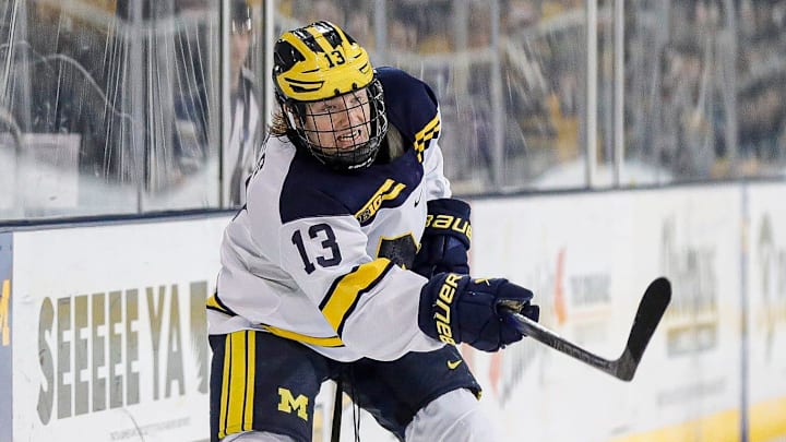 Michigan center TJ Hughes makes a pass against Michigan State defenseman Nash Nienhuis during the third period at Yost Ice Arena in Ann Arbor on Friday, Feb. 9, 2024. Michigan center TJ Hughes makes a pass against Michigan State defenseman Nash Nienhuis during the third period at Yost Ice Arena in Ann Arbor on Friday, Feb. 9, 2024.