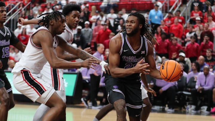 Feb 21, 2026; Lubbock, Texas, USA; Kansas State Wildcats wing Khamari McGriff (21) makes a pass against Texas Tech Red Raiders guard Tyeree Byran (1) in the second half at United Supermarkets Arena. Mandatory Credit: Michael C. Johnson-Imagn Images Feb 21, 2026; Lubbock, Texas, USA; Kansas State Wildcats wing Khamari McGriff (21) makes a pass against Texas Tech Red Raiders guard Tyeree Byran (1) in the second half at United Supermarkets Arena. Mandatory Credit: Michael C. Johnson-Imagn Images