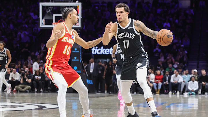 Oct 29, 2025; Brooklyn, New York, USA; Brooklyn Nets forward Michael Porter Jr. (17) looks to drive past Atlanta Hawks forward Zaccharie Risacher (10) in the second quarter at Barclays Center. Mandatory Credit: Wendell Cruz-Imagn Images