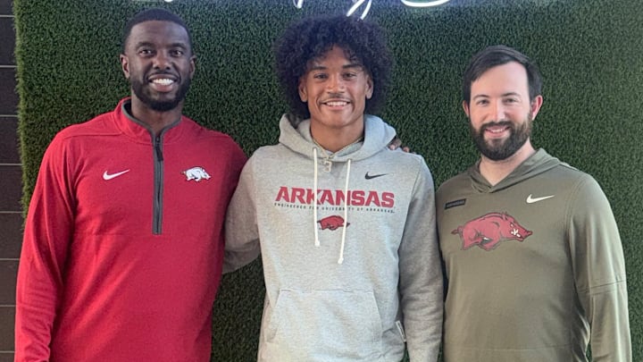 Arkansas Razorbacks wide receiver coach Larry Smith (left), Thompson (Alabaster, Ala.) High School 4-star wide receiver Darion Moseley (middle) and assistant wide receivers coach Aaron Odom during Moseley's unofficial visit April 18.