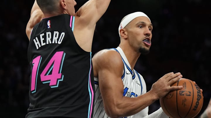 Mar 14, 2026; Miami, Florida, USA;  Orlando Magic guard Jalen Suggs (4) looks to pass as Miami Heat guard Tyler Herro (14) defends during the first half at Kaseya Center. Mandatory Credit: Jim Rassol-Imagn Images