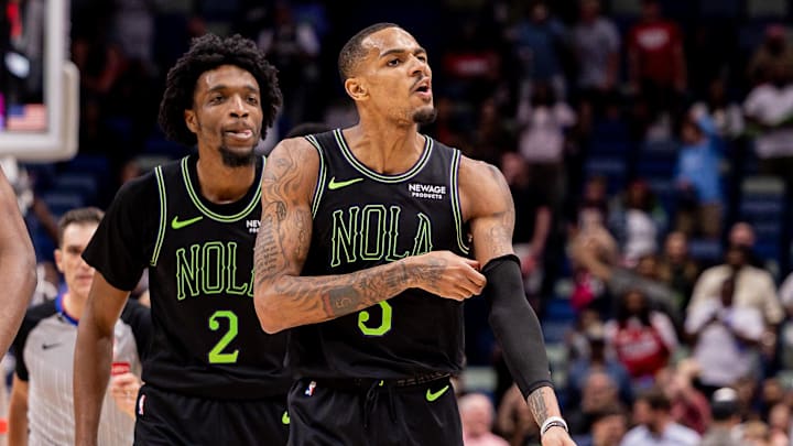 Mar 11, 2026; New Orleans, Louisiana, USA;  New Orleans Pelicans guard Dejounte Murray (5) makes comments in the direction of the Toronto Raptors bench after a play against guard Jamal Shead (23) during the second half at Smoothie King Center. Mandatory Credit: Stephen Lew-Imagn Images