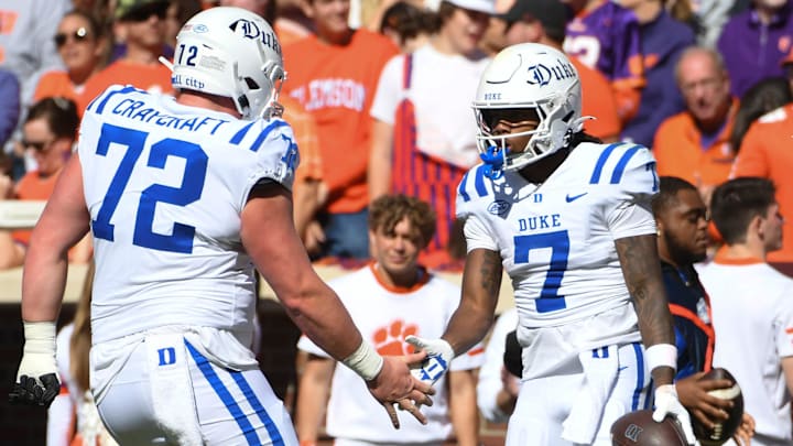 Duke Blue Devils wide receiver Que'Sean Brown (7) celebrates with Duke Blue Devils offensive lineman Matt Craycraft (72) and Duke Blue Devils safety Terry Moore (1) after scoring a touchdown Saturday, Nov. 1, 2025, during the NCAA football game at Memorial Stadium in Clemson, South Carolina.