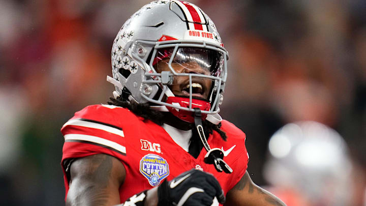Ohio State Buckeyes wide receiver Jeremiah Smith (4) celebrates a touchdown during the Cotton Bowl at AT&T Stadium in Arlington, Texas for the College Football Playoff quarterfinal game against the Miami Hurricanes on Dec. 31, 2025. Ohio State lost 24-14.