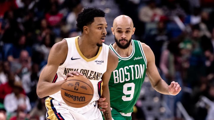 Jan 31, 2025; New Orleans, Louisiana, USA; New Orleans Pelicans guard Trey Murphy III (25) dribbles against Boston Celtics guard Derrick White (9) during the second half at Smoothie King Center. 