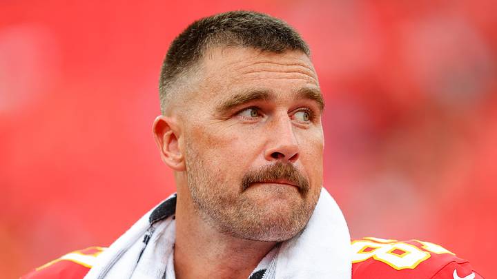 Travis Kelce of the Kansas City Chiefs stands on the field