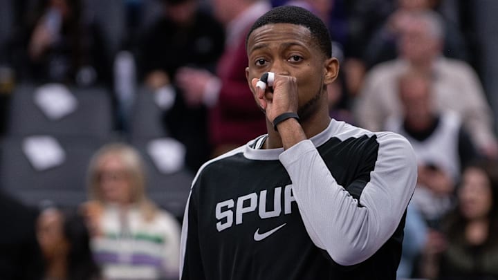 Mar 7, 2025; Sacramento, California, USA; San Antonio Spurs guard De'Aaron Fox (4) looks on during pregame warm ups before the game against the Sacramento Kings at Golden 1 Center.