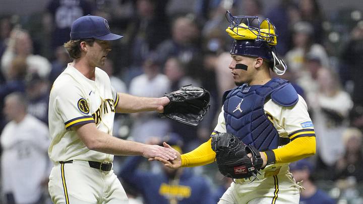Apr 28, 2026; Milwaukee, Wisconsin, USA; Milwaukee Brewers pitcher Jake Woodford (41) and catcher William Contreras (24) celebrate a 13-2 win over the Arizona Diamondbacks at American Family Field. Mandatory Credit: Michael McLoone-Imagn Images