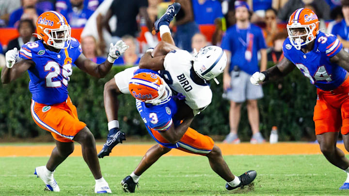 Florida Gators defensive back Jason Marshall Jr. (3) tackles Samford Bulldogs wide receiver Preston Bird (84) during the second half at Ben Hill Griffin Stadium in Gainesville, FL on Saturday, September 7, 2024 against the Samford Bulldogs. The Florida Gators won 45-7 over the Bulldogs. [Doug Engle/Gainesville Sun]