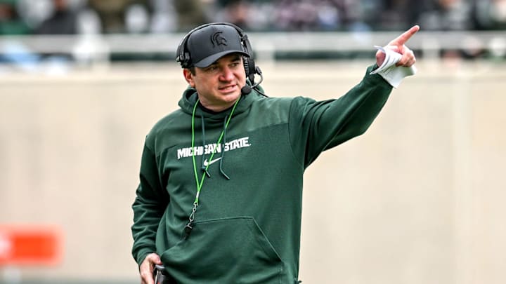 Michigan State's head coach Jonathan Smith communicates with staff on Saturday, April 20, 2024, at Spartan Stadium in East Lansing. Michigan State's head coach Jonathan Smith communicates with staff on Saturday, April 20, 2024, at Spartan Stadium in East Lansing.